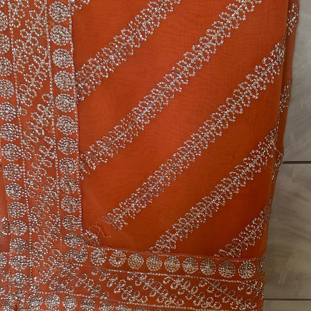Vibrant Orange Fabric with Silver Detailing